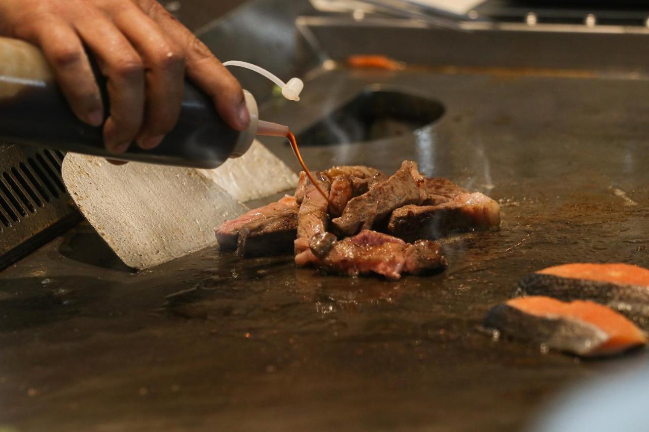 Chatrium Grand Bangkok Exterior foto Soy sauce being used in cooking